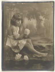 Portrait of a Girl Barefoot with a Bouquet of Flowers in Hand