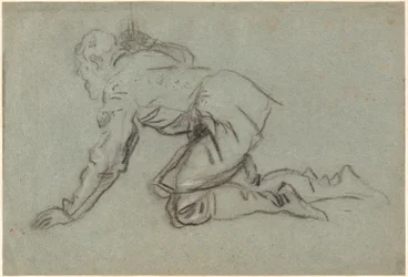 A Kneeling Man Holding a Staff