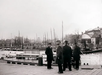 Men by a canal boat, Rotterdam