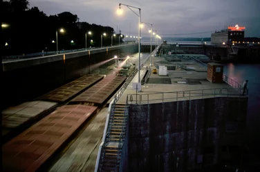 Barges Pass through a Mississippi River Lock Pushed by a Towboat