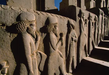 Relief bas-reliefs sculpture of tribute bearers with offerings cover much of the Persepolis