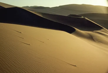 View of sharply-cut shadowed dunes near Dunhuang. Gansu Province, People