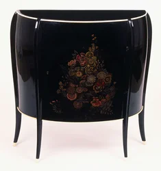 A bow-front chest of drawers