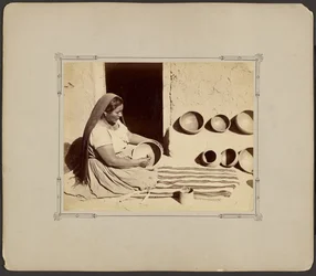 Woman Polishing Pottery