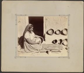Woman Polishing Pottery