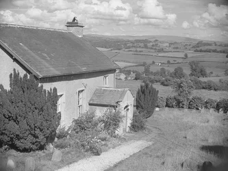 House to left of image and view beyond