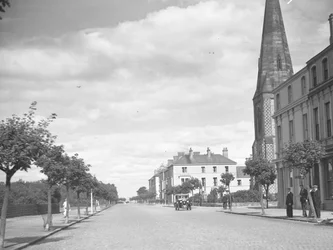 Church and men standing to right of image