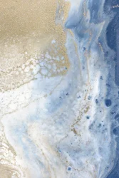 Swirling Blue and Gold Patterns Resemble a Cosmic Landscape