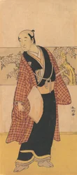 An Unidentified Actor Stands with an Open Fan in His Hand