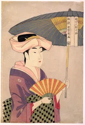 Young Woman Blowing a Glass Pipe