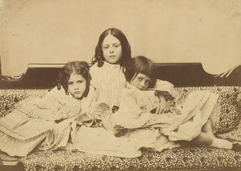 Edith, Ina and Alice Liddell on a Sofa, Summer 1858