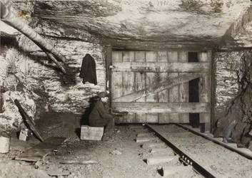 Boy Waiting for Coal to Come Through