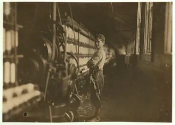 John Dempsey, 11 or 12 Years Old, Saturday Worker in the Mule-Spinning Room at Jackson Mill, Fiskeville, Rhode Island (1909)