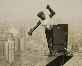 Worker Giving High-Signal to the Derrick Crew
