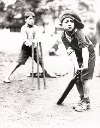Boys playing cricket