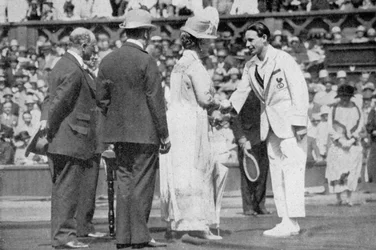 Jean Borotra receives his medal from Queen Mary on centre court