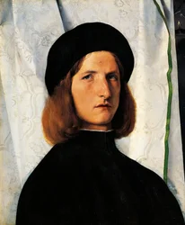 Portrait of young man with lamp