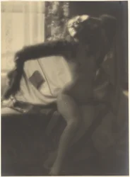 Female Nude Seated on Bed