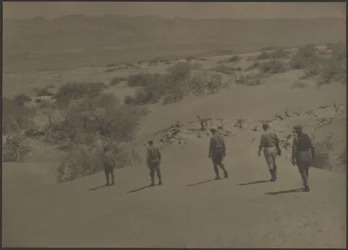 Five Men Walking in Desert