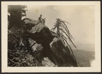 [Hiker Seated on Boulder]