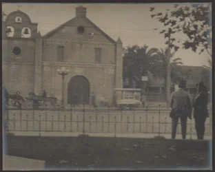 [Men Standing Before Mission]