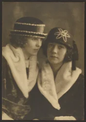 [Portrait of Two Women in Hats with White Piping]