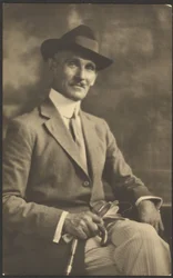 Portrait of a Man Holding Cane and Gloves