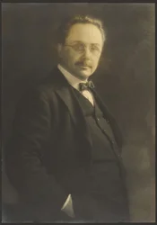 Portrait of a Man Standing with Hand in Pocket