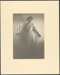 Portrait of a Woman Standing at Door