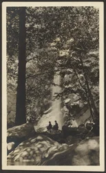 Two Figures by Waterfall in the Woods