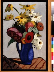 Bouquet of flowers in blue vase