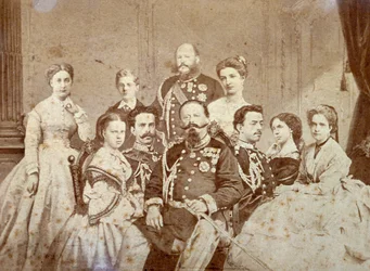 The Picture Portrays Various Members of the Royal Family of Savoy. At the Center, Seated, Victor Emmanuel II, Umberto I and Amedeo in Full Dress Uniform; the Daughters of the Sovereign and Elisabetta of Saxony in Elegant Clothes. In the Background