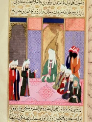 The prophet Muhammad, with his face covered, probably in conversation with his companion Omar