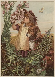 Girl with dog smelling flowers