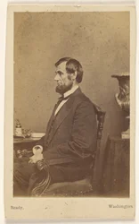 Abraham Lincoln seated, in profile