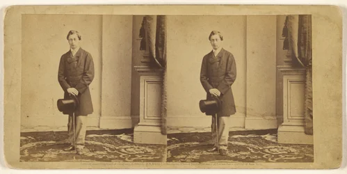 [Unidentified young man holding a top hat and walking stick, standing]