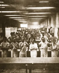 Cooks in a large camp mess hall during the American Civil War