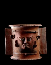 Pre-Columbian Art, Mayan Civilization, Late Classical Period: Cylindrical Burial Urn of Clay Decorated with a Human Face. From Quiche, Guatemala