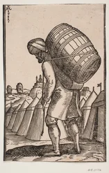 Man Carrying a Barrel on His Back in a Tent Camp