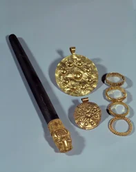Sharpening stone and granulation rings. From the site of Susa, Iran. 1150 BC. Paris, Louvre Museum