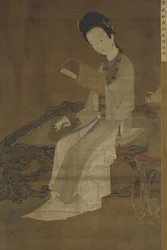 Young Woman Reading a Book of Poems