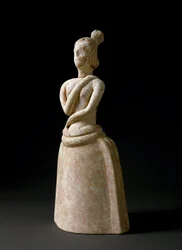 Minoan art: terracotta figurine of a woman in an attitude of worship. From the sanctuary of Piskokephalo in Crete. 1700-1450 BC. 24.6 cm, Heraklion, Archaeological Museum
