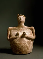 Terracotta vase in the shape of a woman supporting her chest