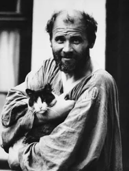 Gustav Klimt with a cat, 1911