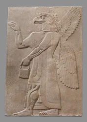 Relief panel of winged eagle-headed supernatural figure