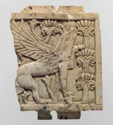 Furniture Plaque Carved in Relief with a Griffin in a Floral Landscape, c.9th-8th Century BC