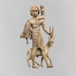 Statuette of a man with an oryx, a monkey, and a leopard skin, c.8th century BC