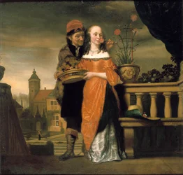 A Man Holding a Carnation to a Woman