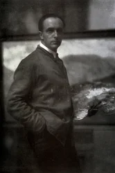 Three-quarter-length portrait of Cesare Maggi. The painter, dressed in smock, is holding a palette in his left hand. In the background the canvas he is working on