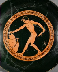 Young athlete taking oil from a large jar